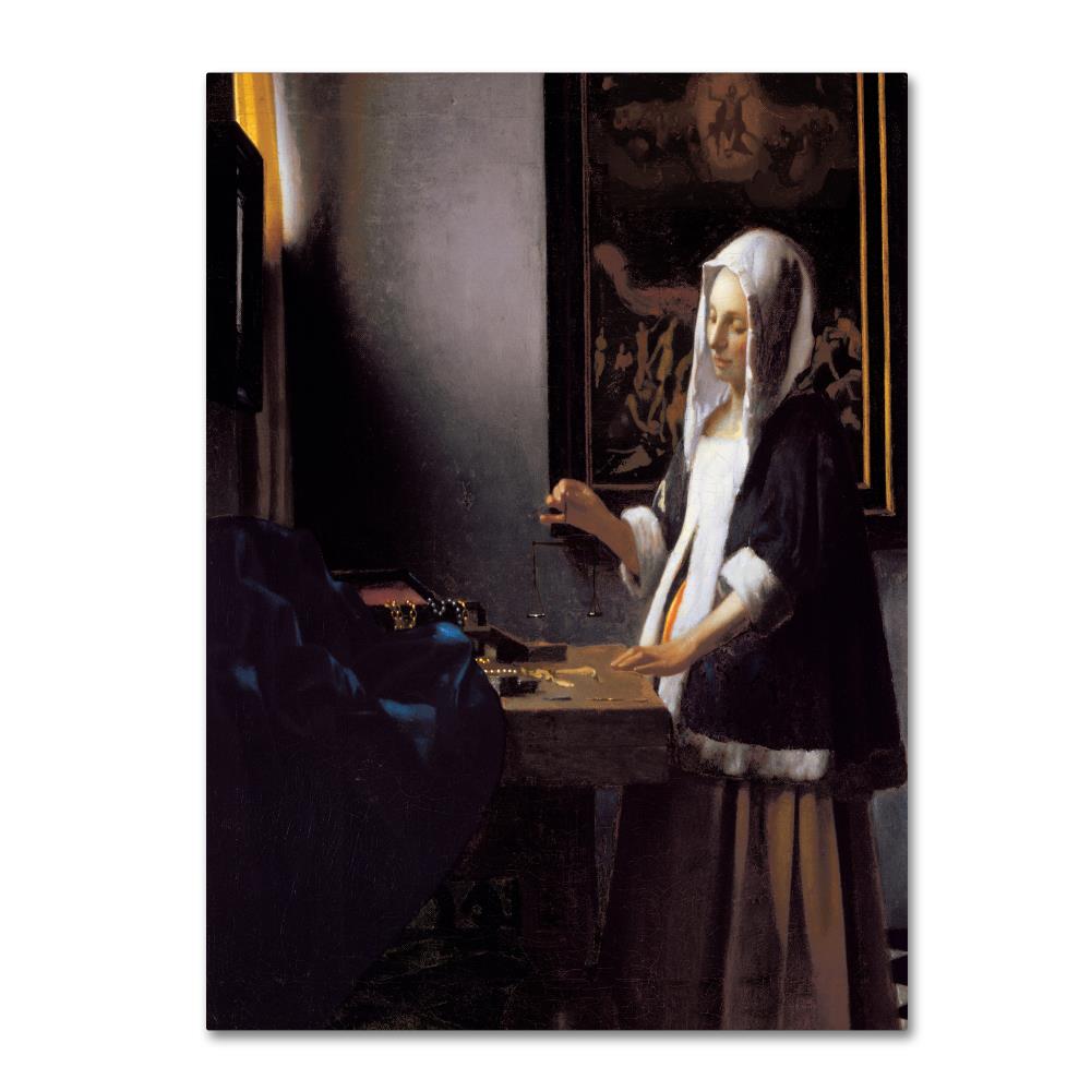 jan vermeer woman holding a balance