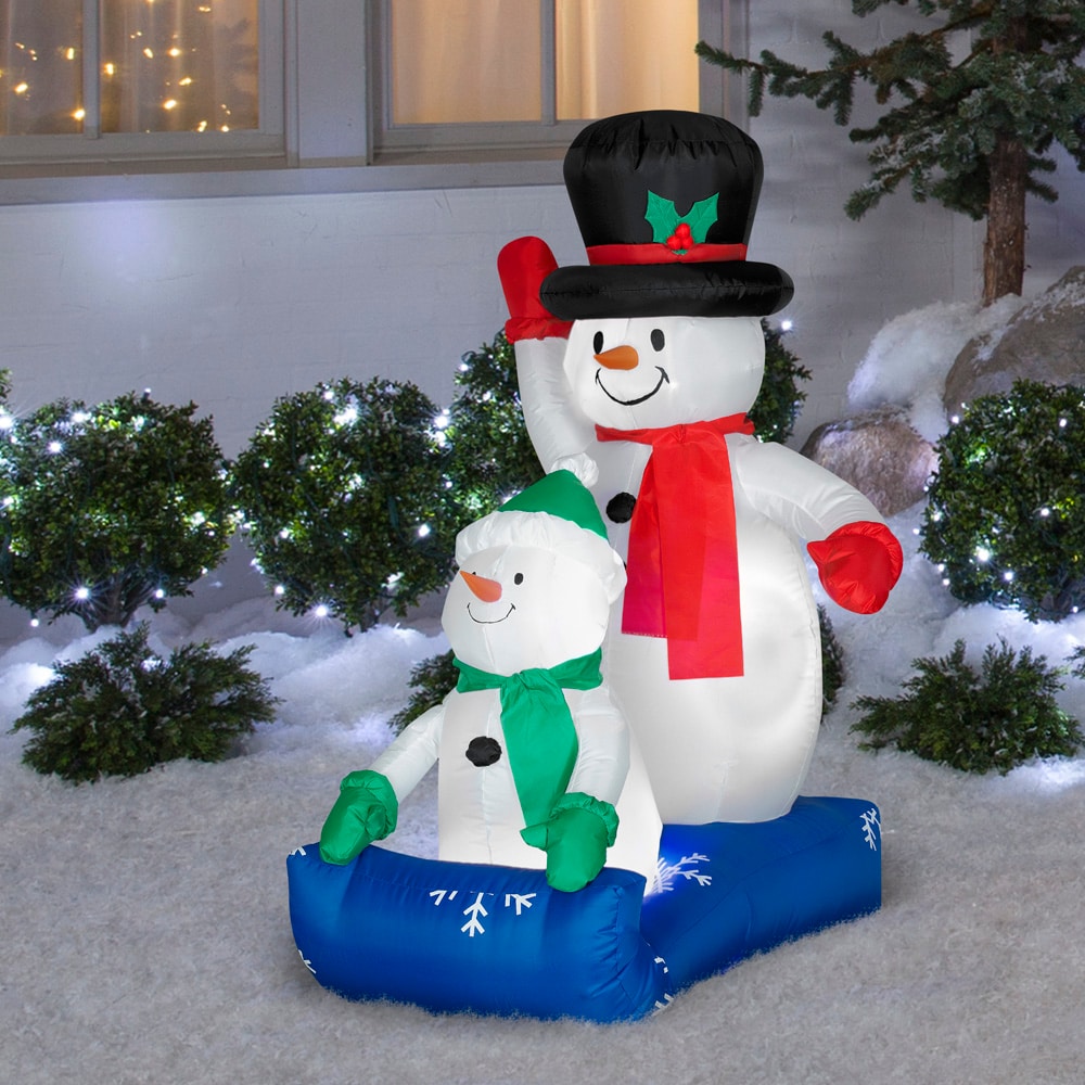 UNIFEEL 4ft Inflatable Snowman with Kaleidoscope Lightshow Colorful Light Merry Christmas Inflatable Lighted Yard Decoration with Blower and Adaptor for Winter Indoor Porch Outdoor Decor