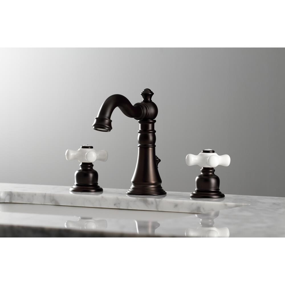 Kingston Brass American Classic Oil-Rubbed Bronze 2-handle Widespread Mid-arc Bathroom Sink Faucet with Drain