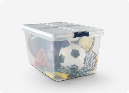 A clear storage tote full of sports equipment.