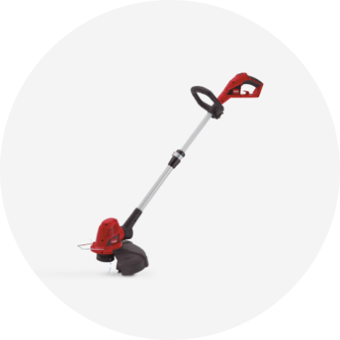 A red Toro straight shaft electric string trimmer.