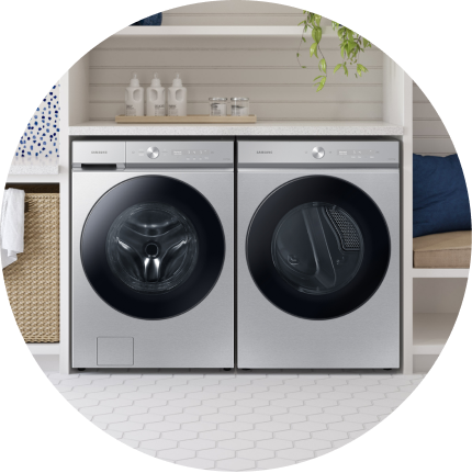 A stainless steel washer and dryer set.