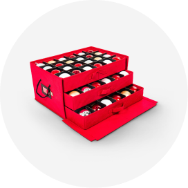 Ornaments in a red ornament storage box with 3 storage compartments.
