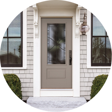 A Pella entry door on a brick house.