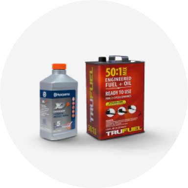 A bottle of Husqvarna fuel and a can of Tru Fuel fuel plus oil mix.