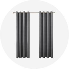 Two gray grommet-style curtain panels on a brushed nickel rod.