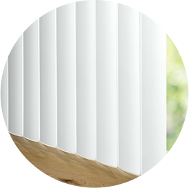 A close-up of white vertical blinds.