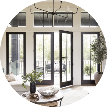 Pella patio doors opened to an outdoor living space.