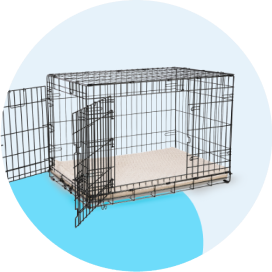 A black wire dog crate with open gates.
