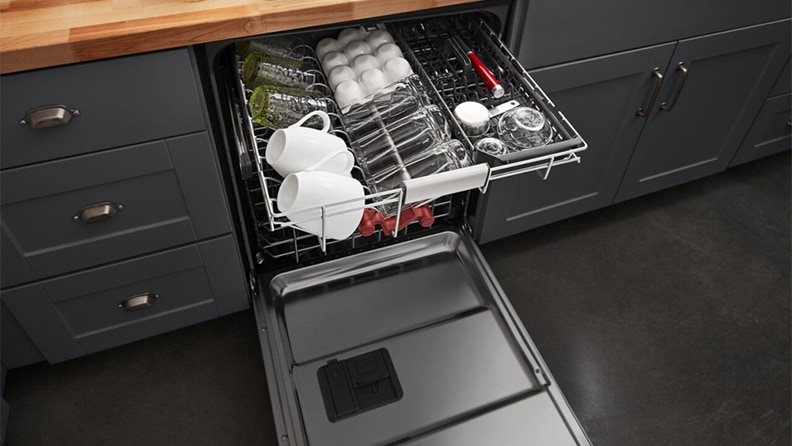 Repairing A Dishwasher   Open Dishwasher With Utensils 