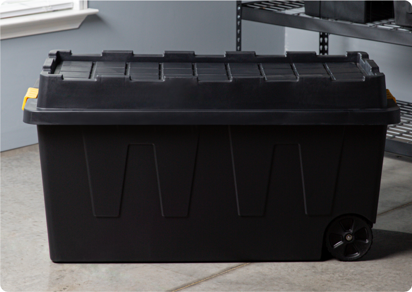 An extra-large black storage container. 