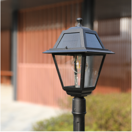 A black traditional carriage lantern post light.