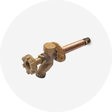 A sillcock valve with a brown handle.
