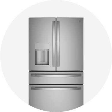 A stainless steel G E Profile French door refrigerator with an ice maker in the door.