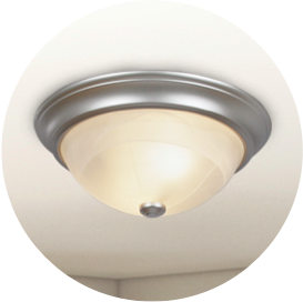 A nickel finish round flush mount light with frosted glass shade.