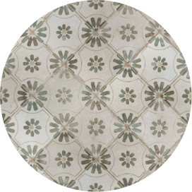 A decorative encaustic tile swatch with a floral pattern.