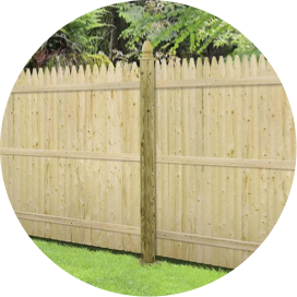 A section of wooden fence in a yard.