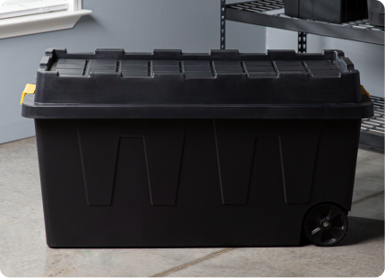 An extra-large black storage container. 