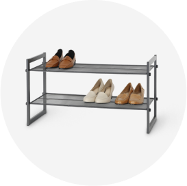 3 pairs of shoes on a metal 2-tier shoe rack.