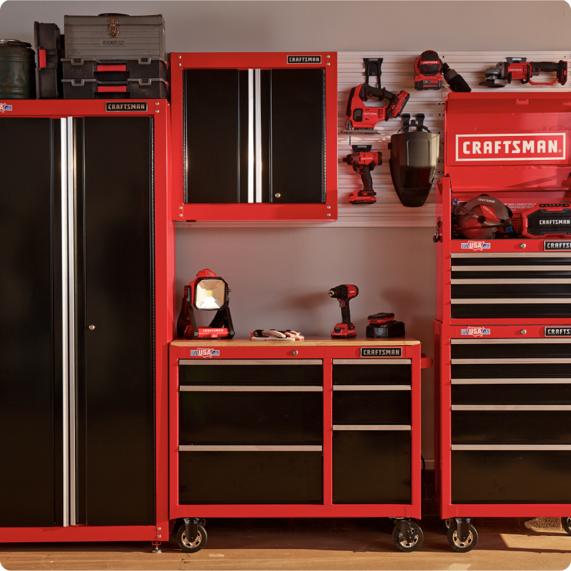 A CRAFTSMAN garage storage collection with cabinets, work bench, rail system and tool chests.