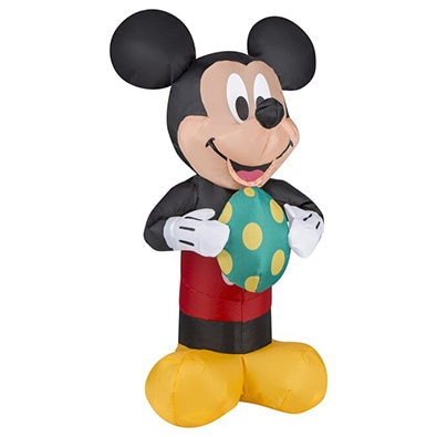Mickey Mouse inflatable holding an Easter egg.