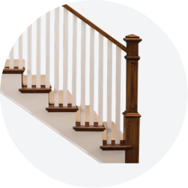 A staircase with dark railing and white balusters.