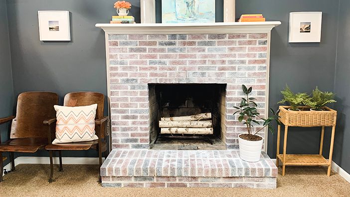 living room with brick fireplace