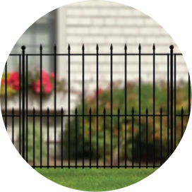 A section of black metal fencing in a yard.
