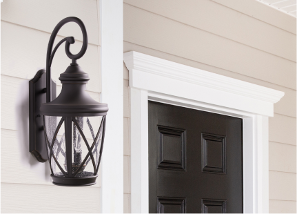 A black traditional carriage lantern outdoor wall light.