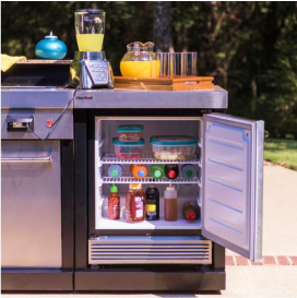 An outdoor mini fridge in an outdoor kitchen bar.