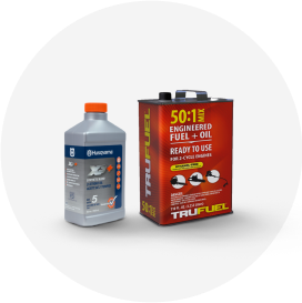 A bottle of Husqvarna fuel and a can of Tru Fuel fuel plus oil mix.