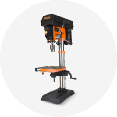 An orange WEN drill press.