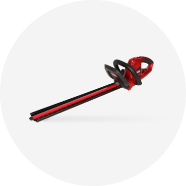 A red Toro corded electric hedge trimmer.