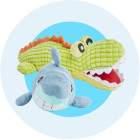 A gray plush shark dog toy and a green plush alligator dog toy.
