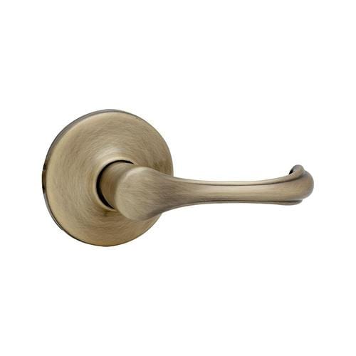 Kwikset Dorian Antique Brass Reversible Passage Door Handle in the Door