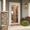 Retractable storm door