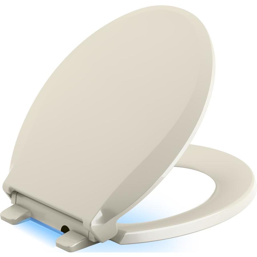 KOHLER Cachet Nightlight Almond Round SlowClose Toilet Seat in the