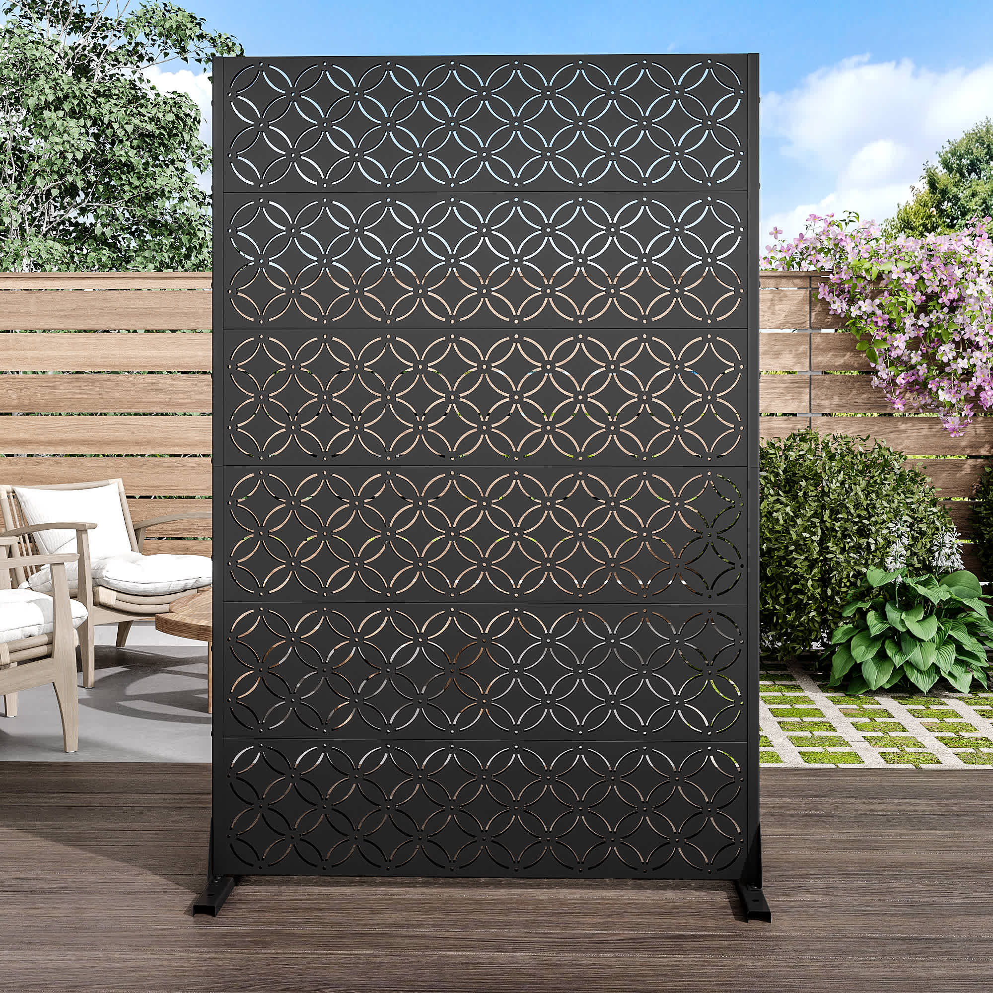 Black metal privacy screen panel standing on a deck.