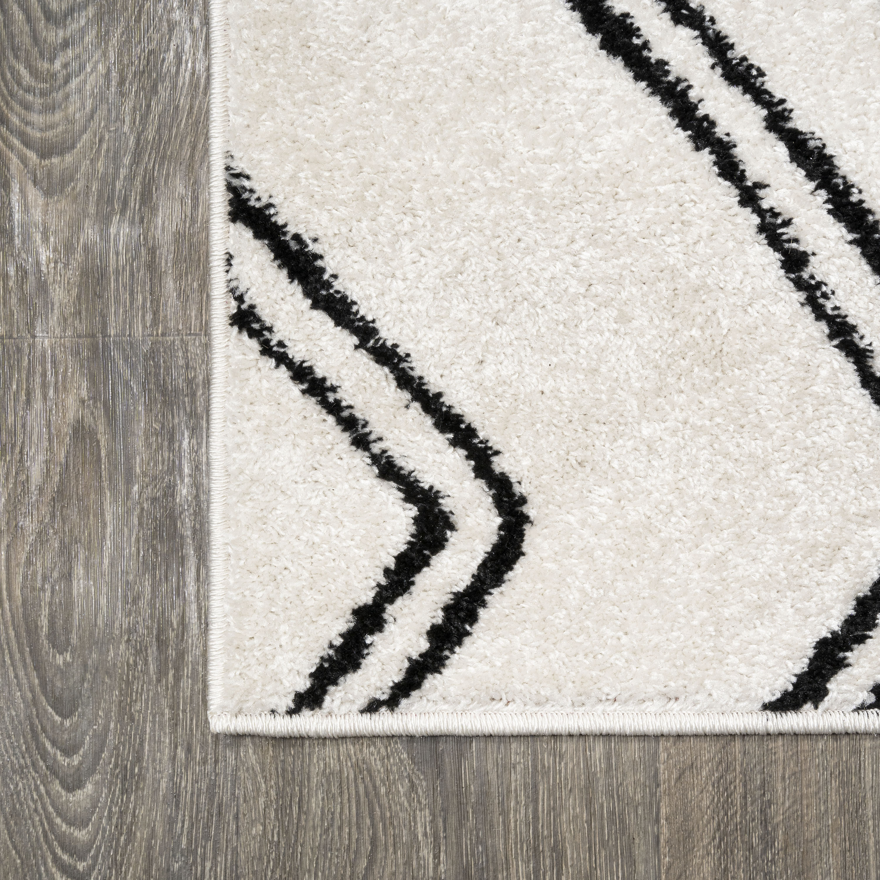 Deia Black and White Geometric Shag Area Rug