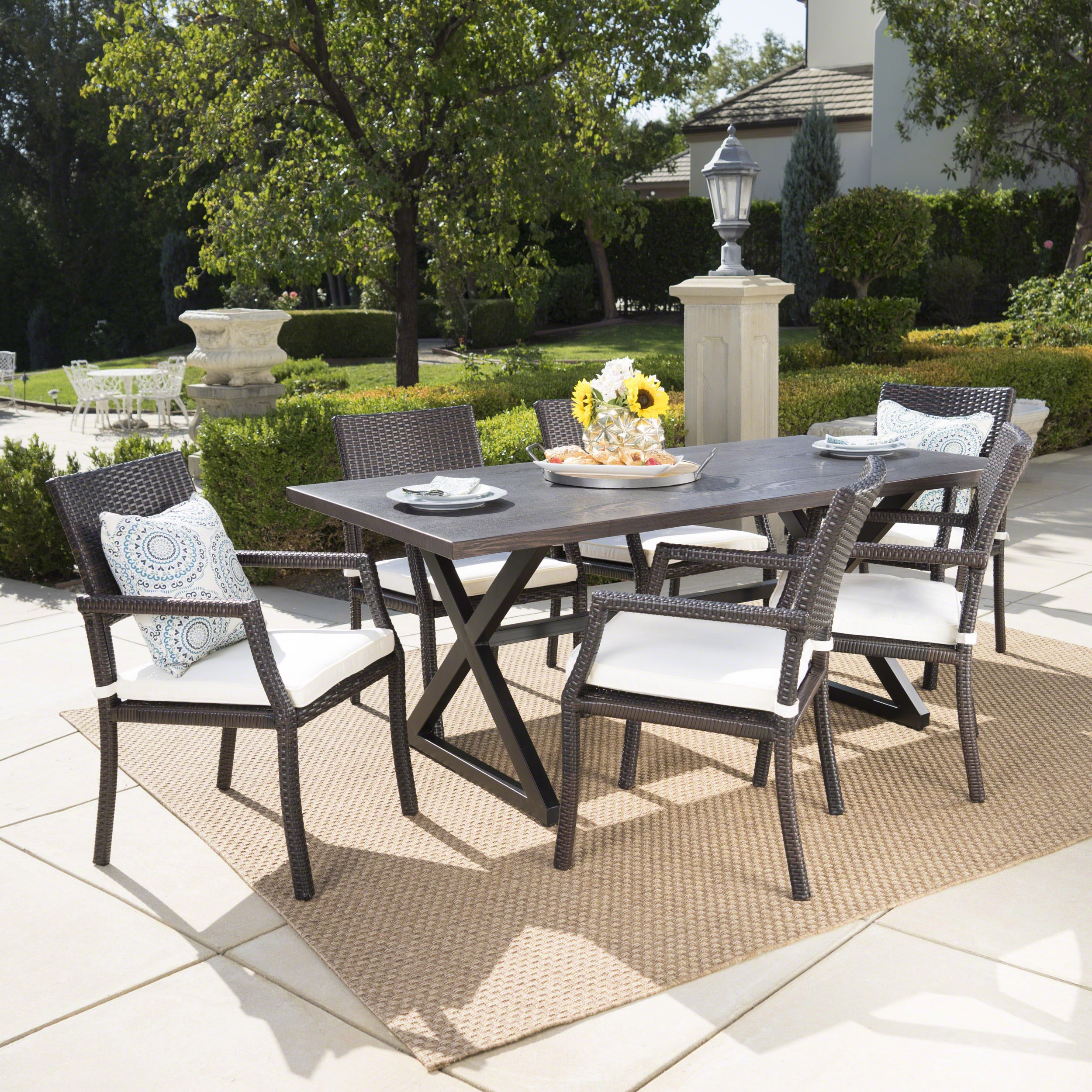 Christopher Knight Home 302507 Alani Outdoor 7 Piece Brown Aluminum Dining Set with Multibrown Wicker Dining Chairs and White Water Resistant Cushions