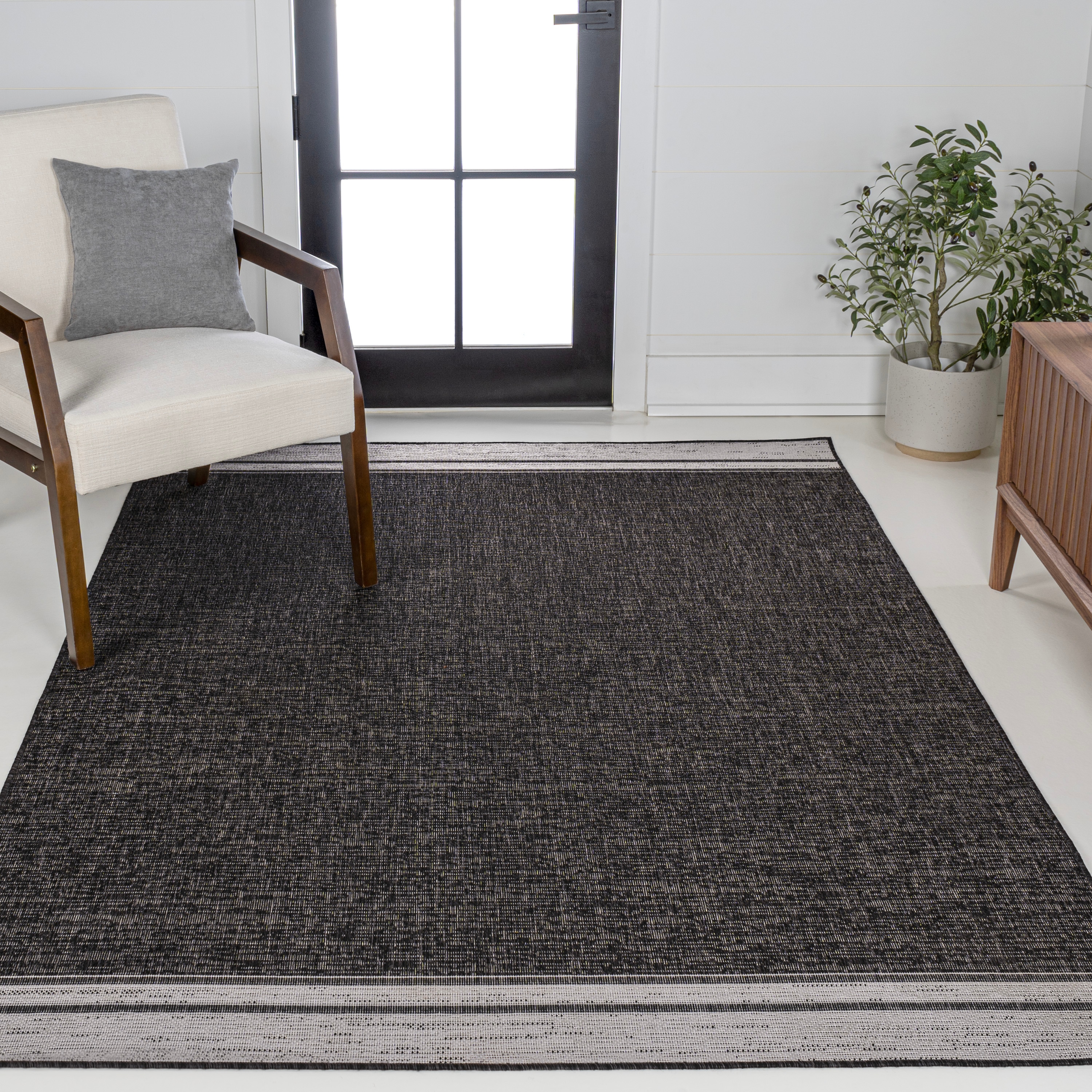 JONATHAN  Y TSN213A-8 TUSCAN SUN Alda Minimalist Mingled Solid 8 x 10 (ft) Loomed Polypropylene Black/Cream Rectangular Indoor/Outdoor Solid Industrial Area rug