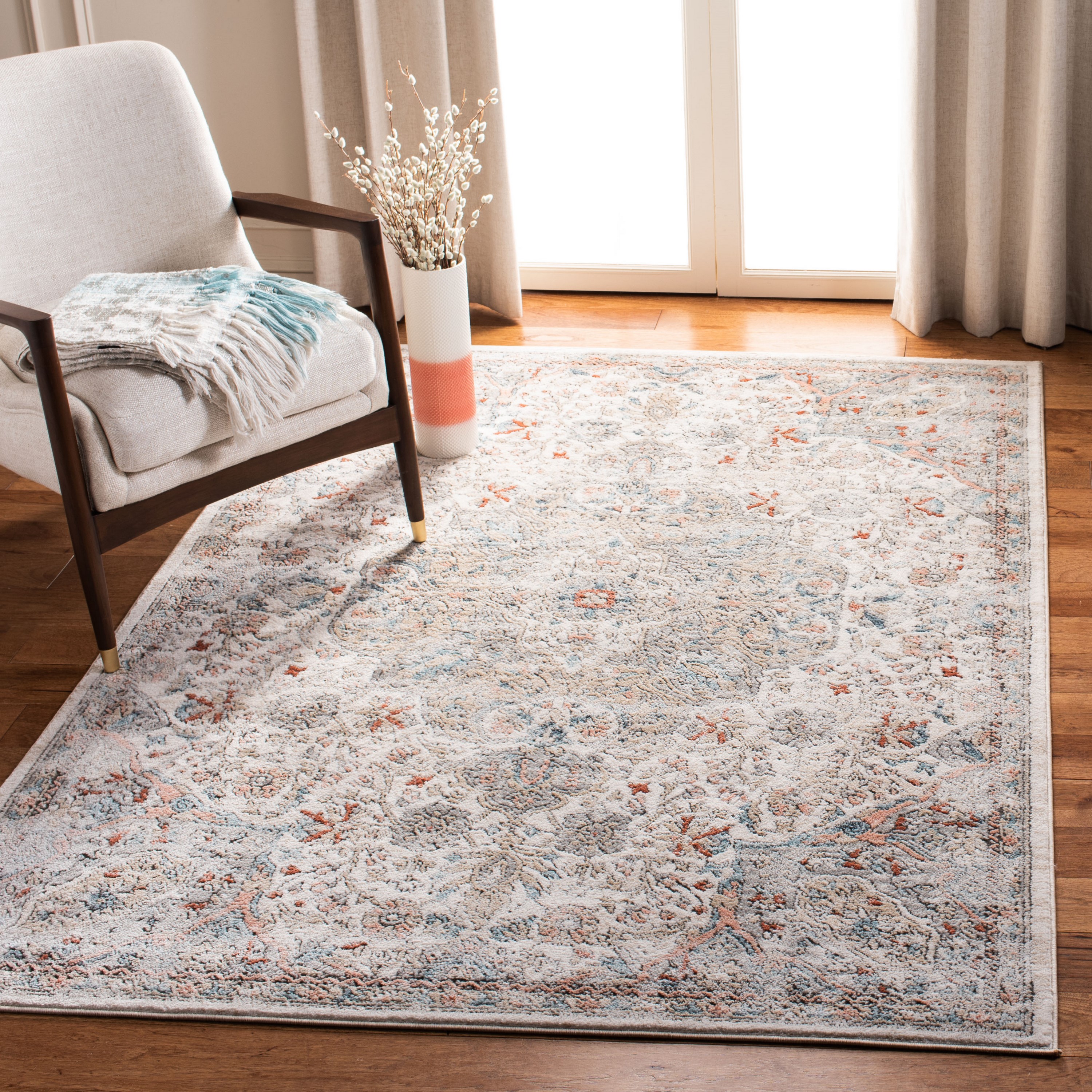 Ivory and Grey Medallion Synthetic 4' x 6' Area Rug