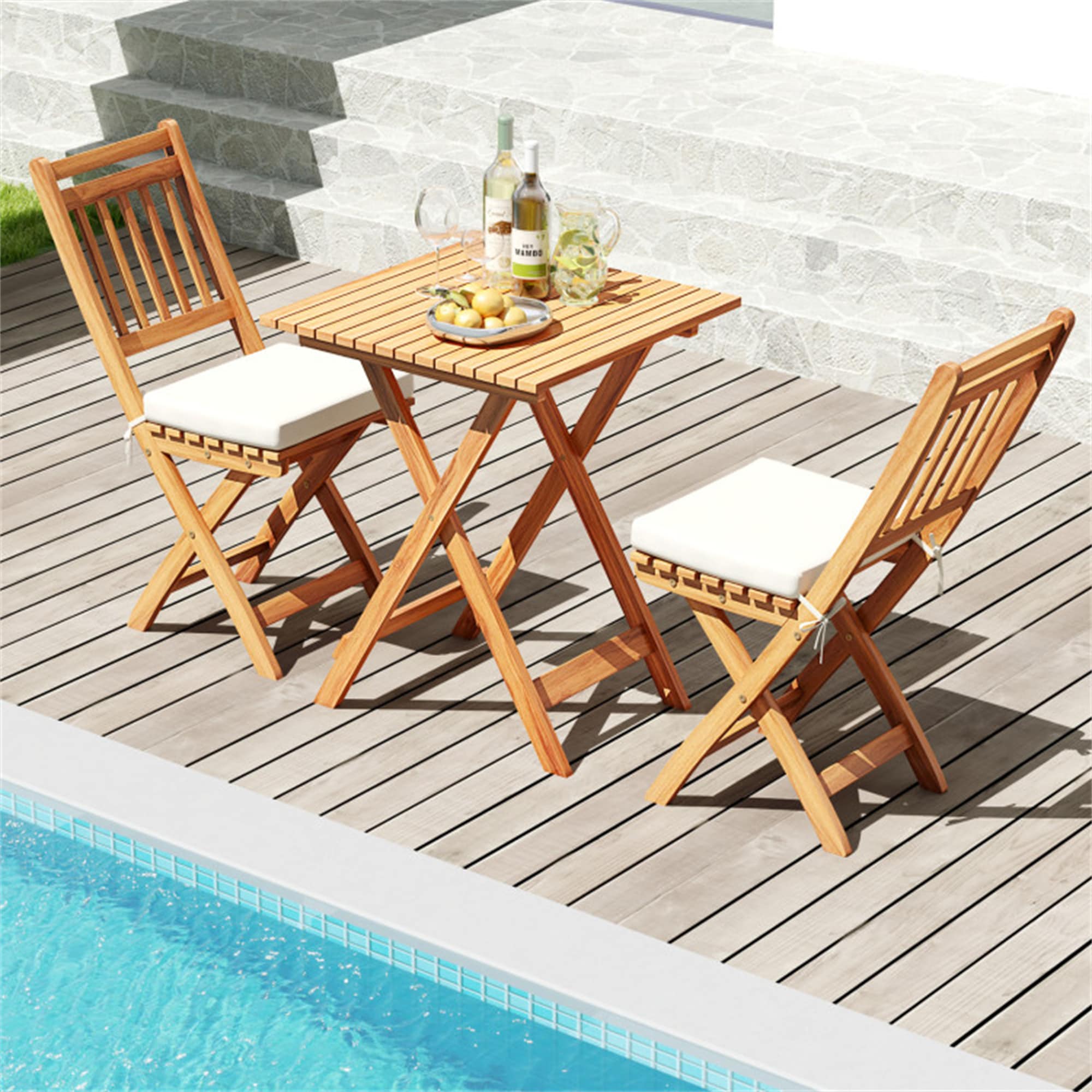 Wooden folding bistro set on a poolside deck