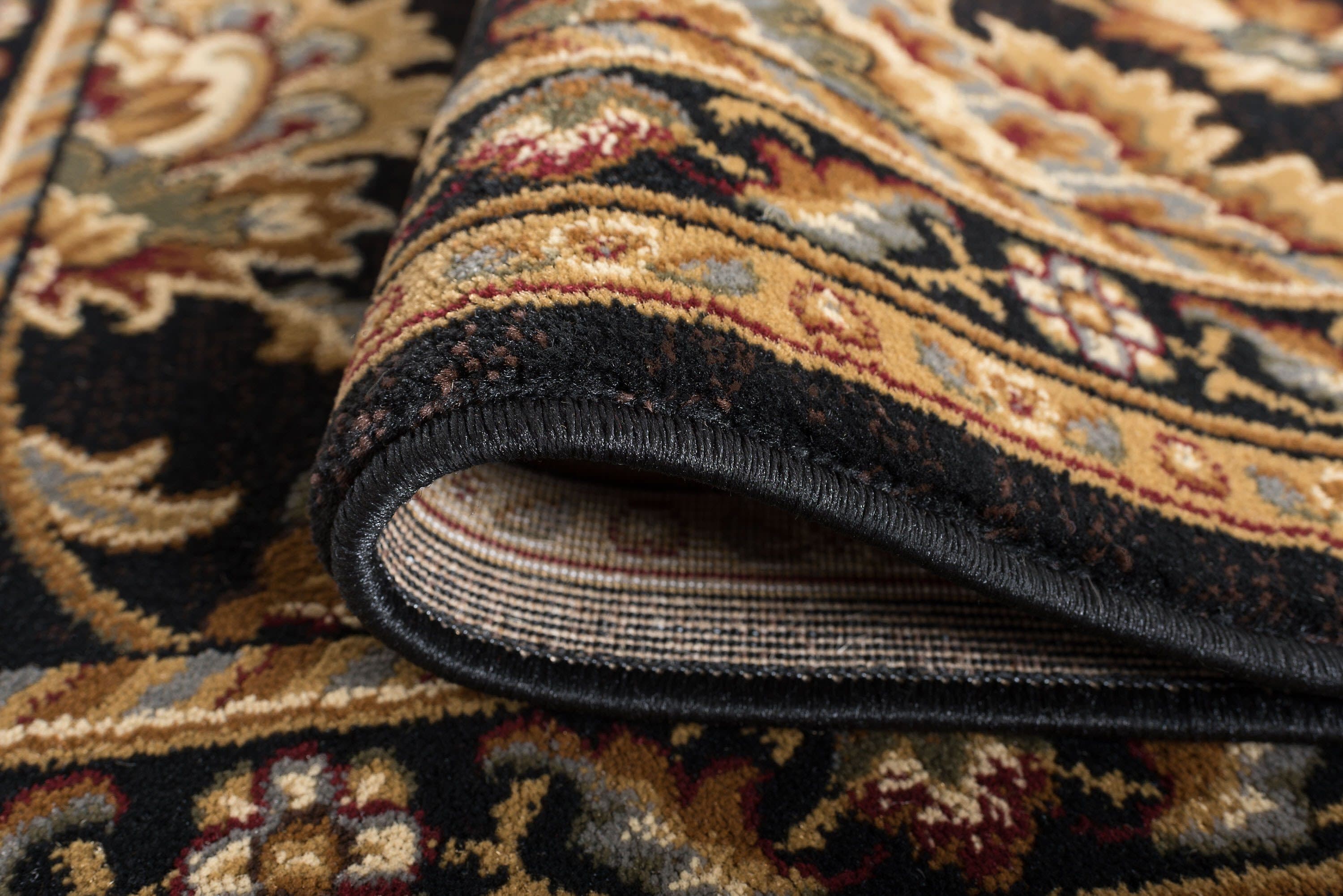 Sensation 5' x 7' Black Synthetic Easy-Care Traditional Area Rug