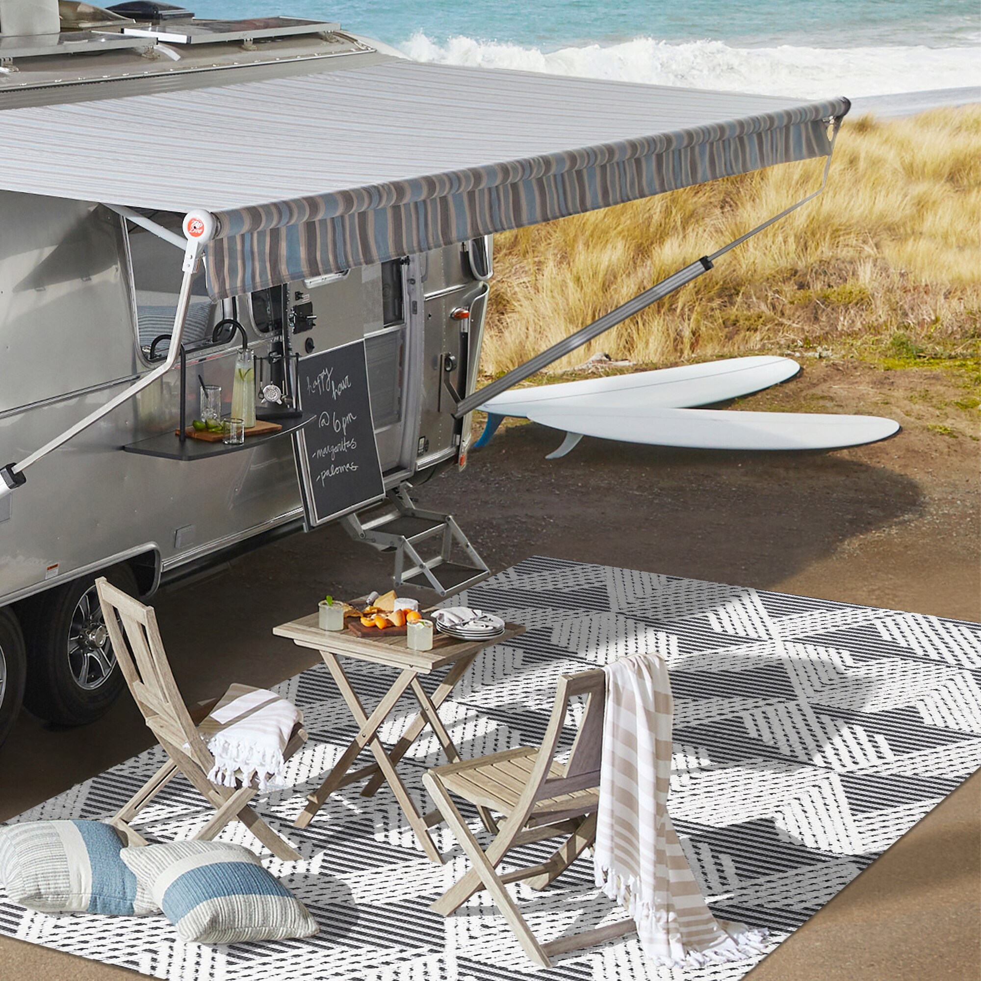 Black and Ivory Geometric 4' x 6' Synthetic Area Rug