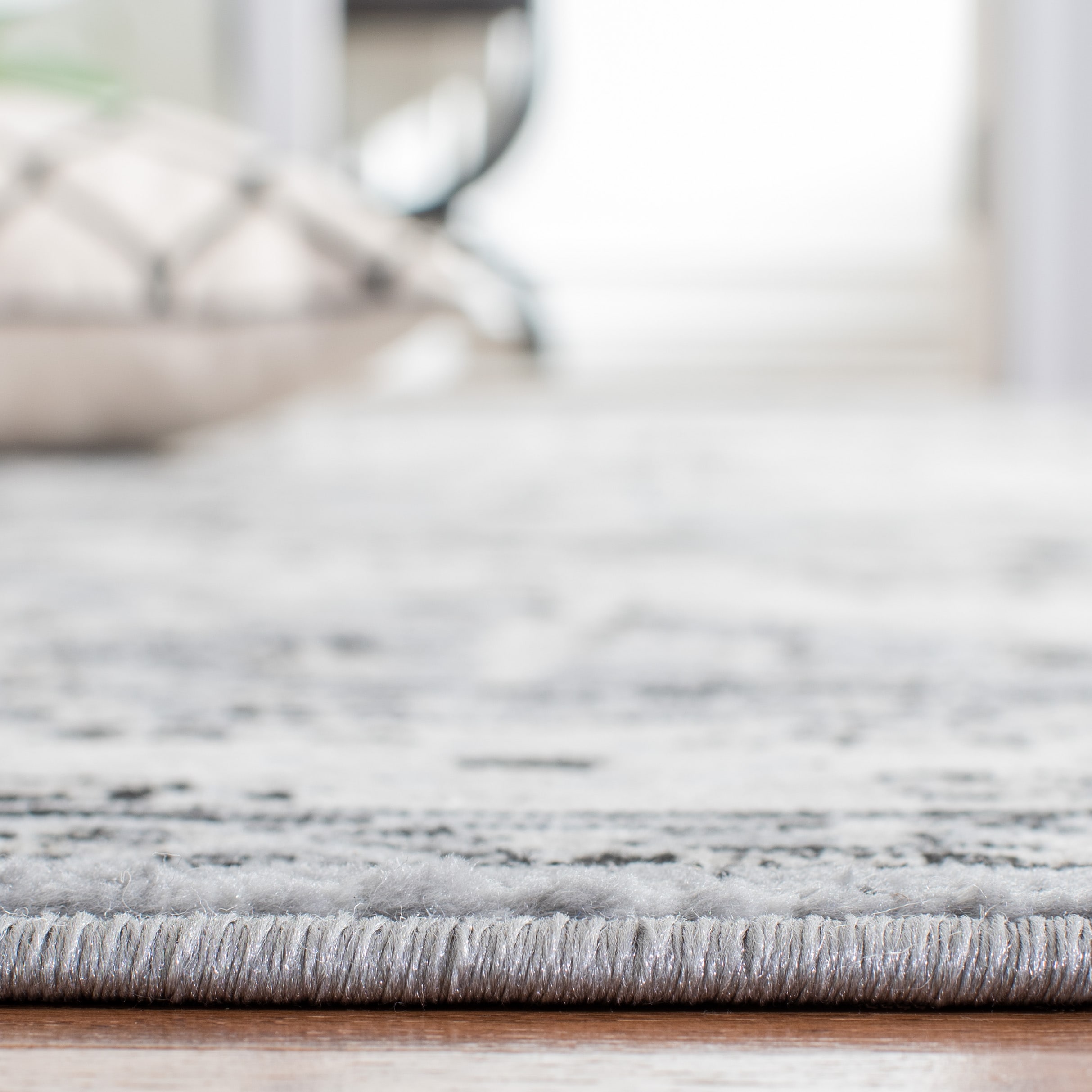 Elegant Heirloom 9' x 12' Grey and Black Synthetic Area Rug