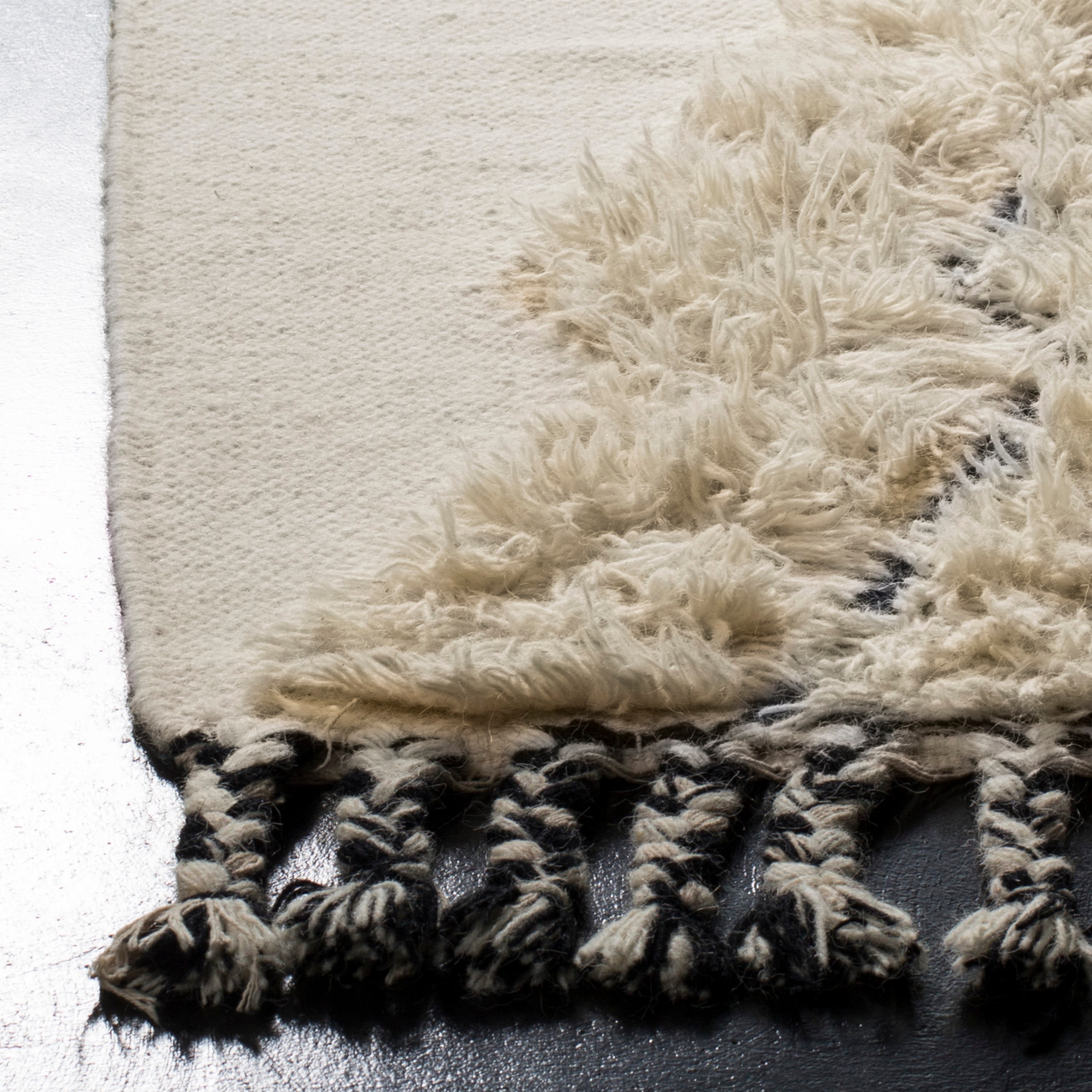 Kenya 9' x 12' Black and Ivory Wool Hand-Knotted Rug