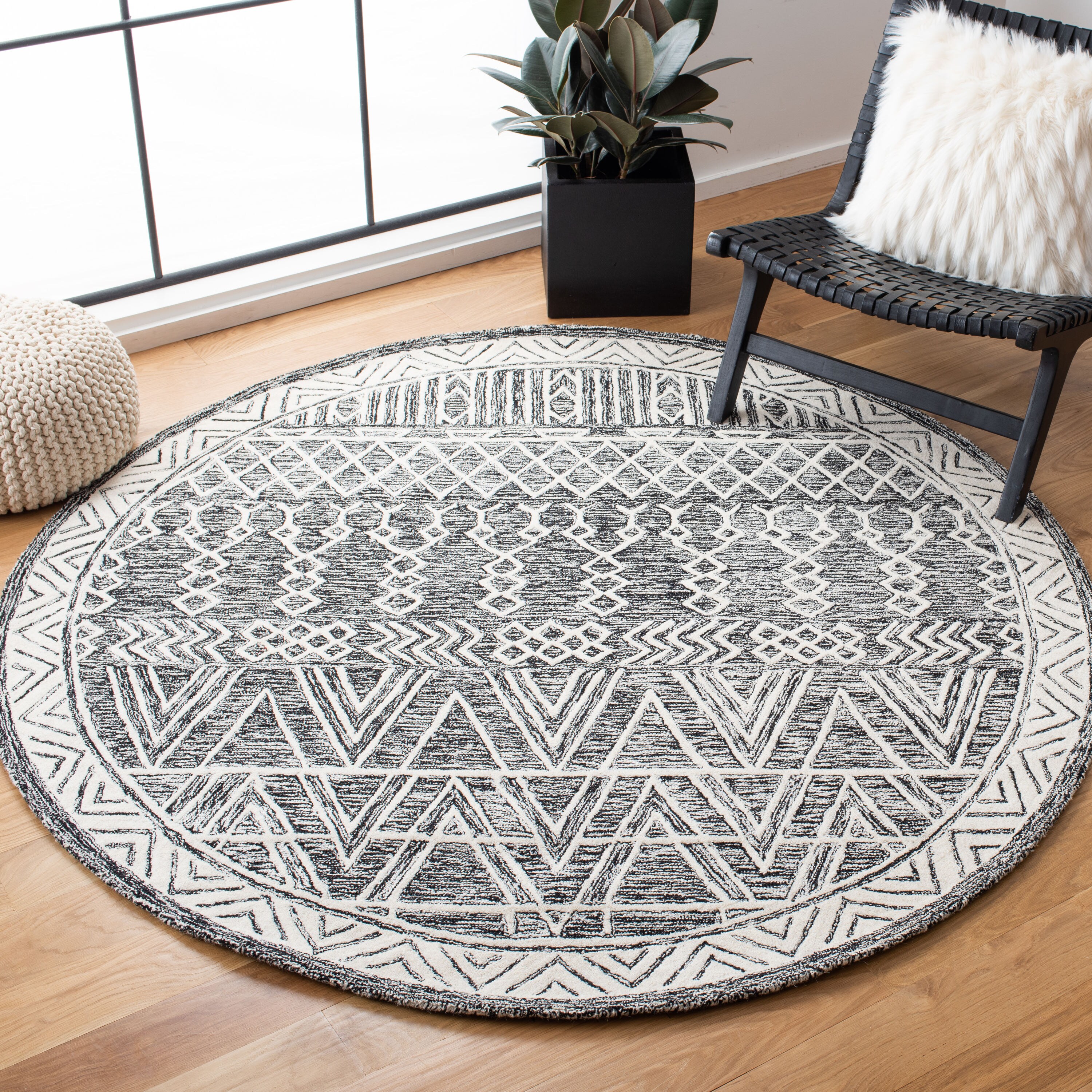 Handmade Abstract Black and Ivory Wool Round Rug 6'