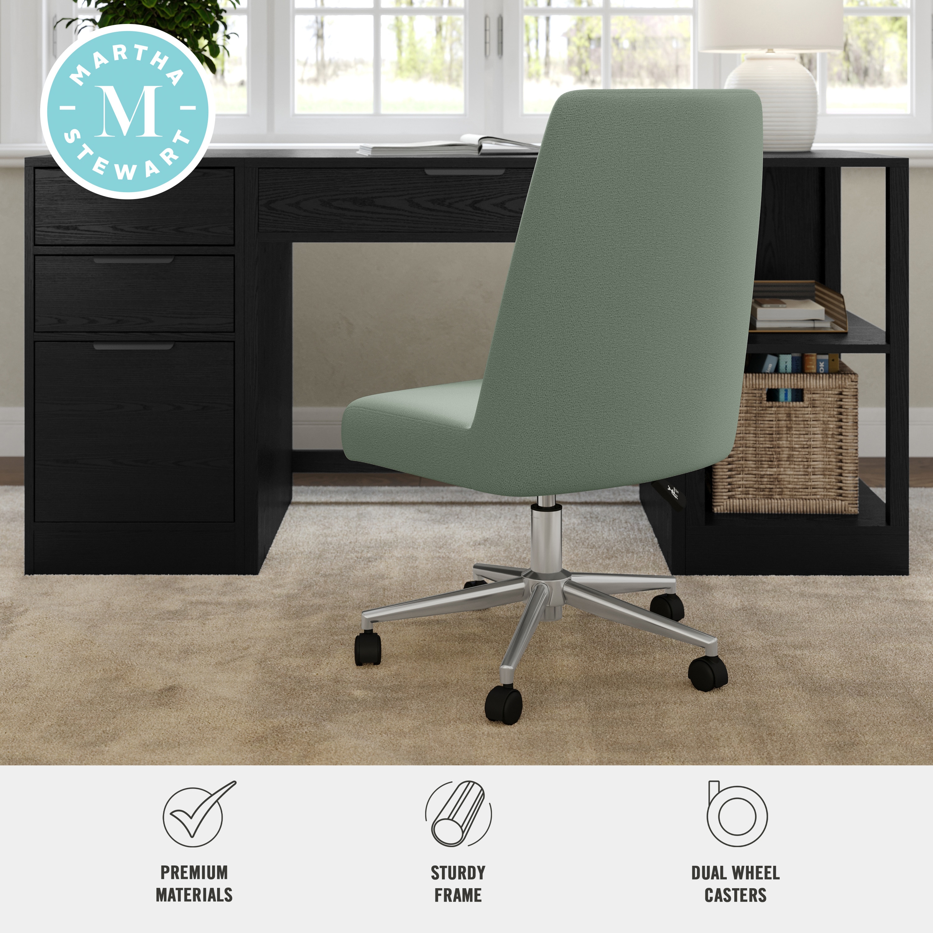 Mint green upholstered office chair viewed from the back at desk