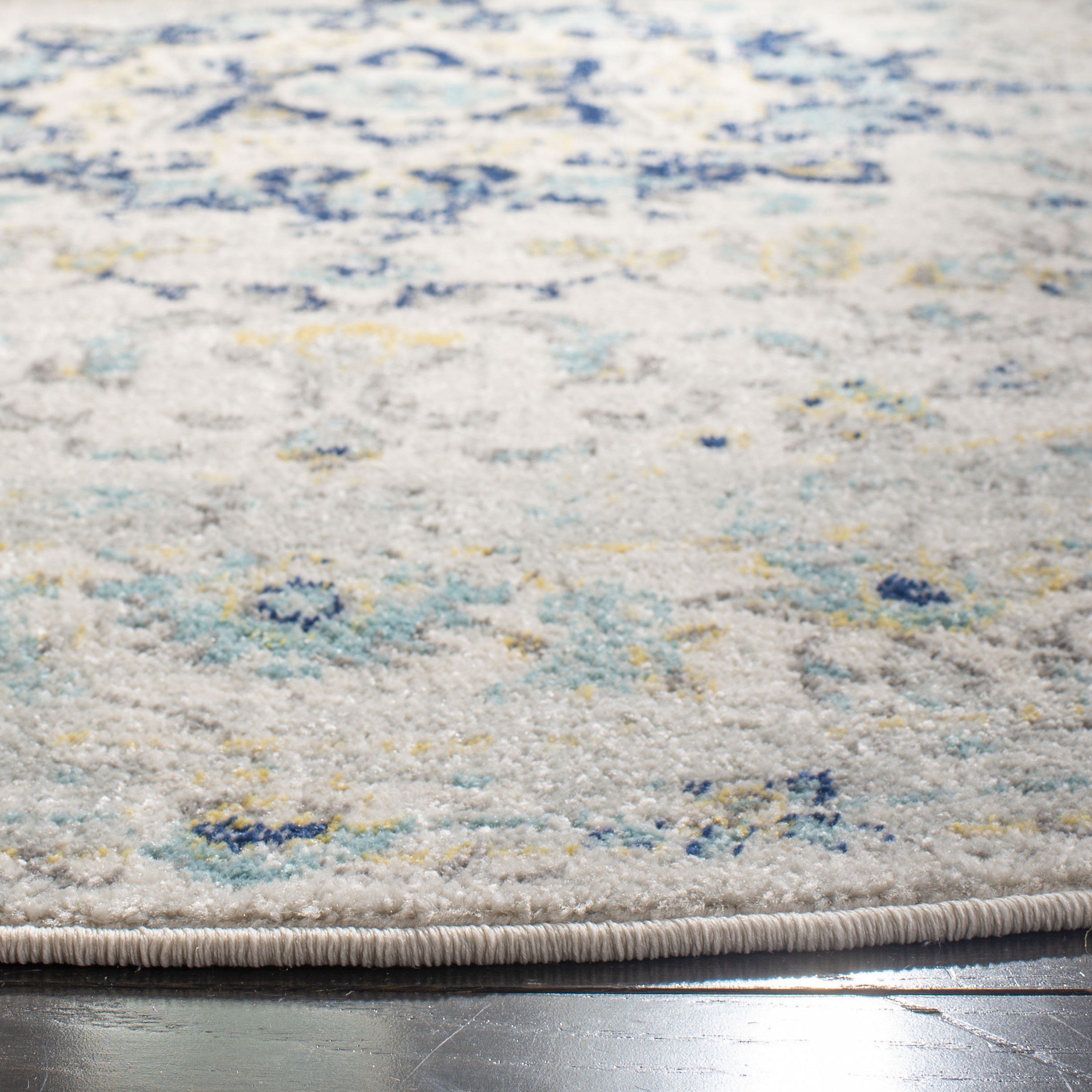 Ivory and Blue Round Synthetic Medallion Area Rug